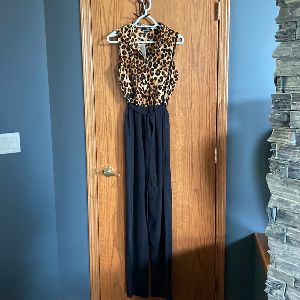 Suzanne Betro jumpsuit! Sleeveless Leopard print top and black wide leg pants.